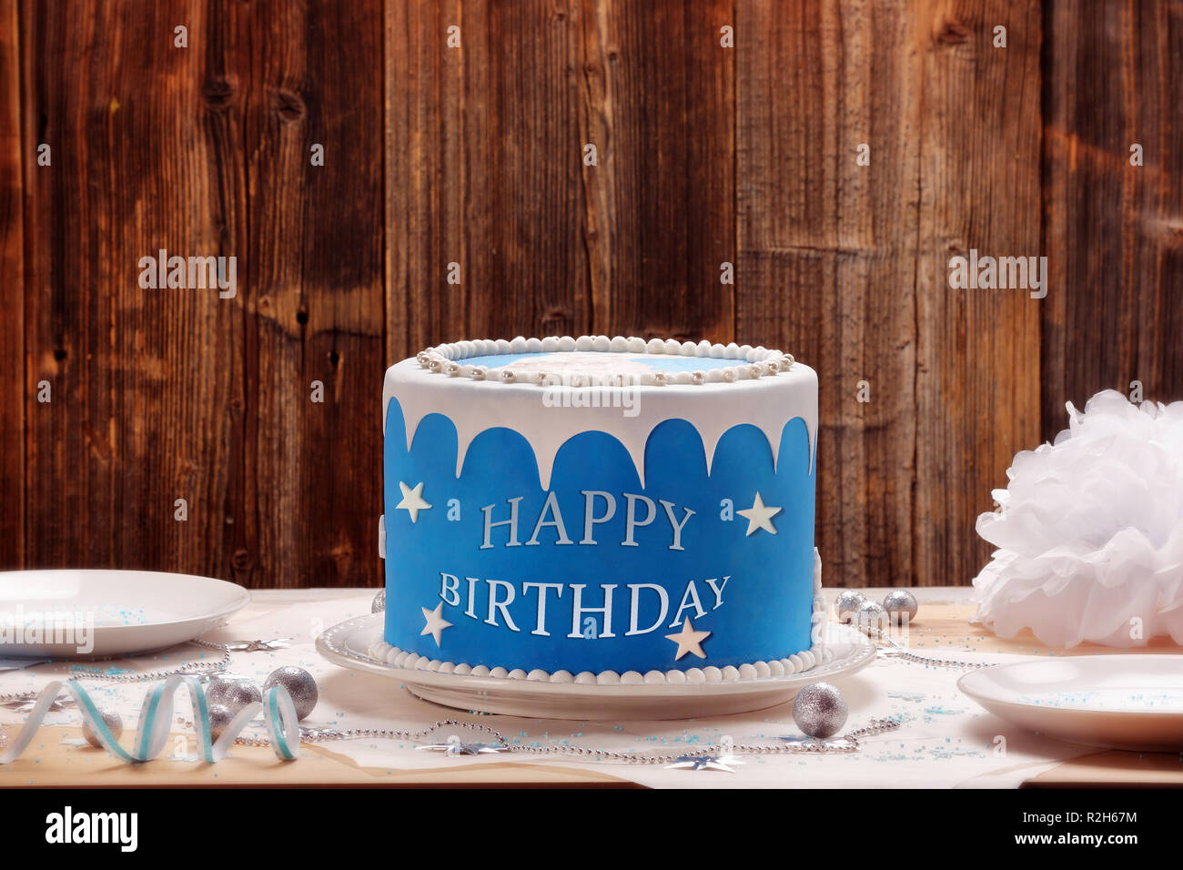 Blue cake with the happy birthday inscription and empty space for text Stock Photo