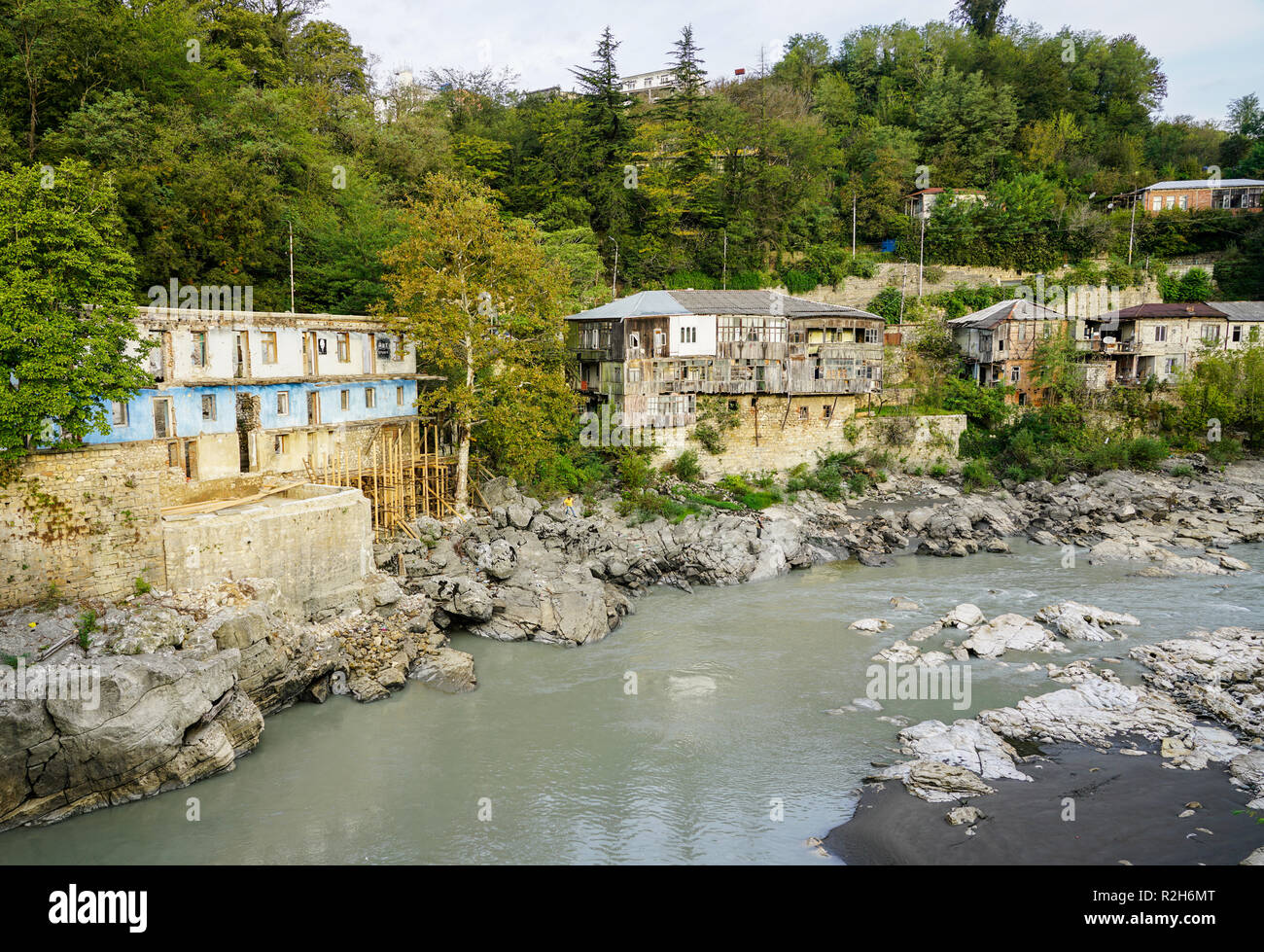 a river with old poor houses on its shore, Kutaisi, Stock Photo