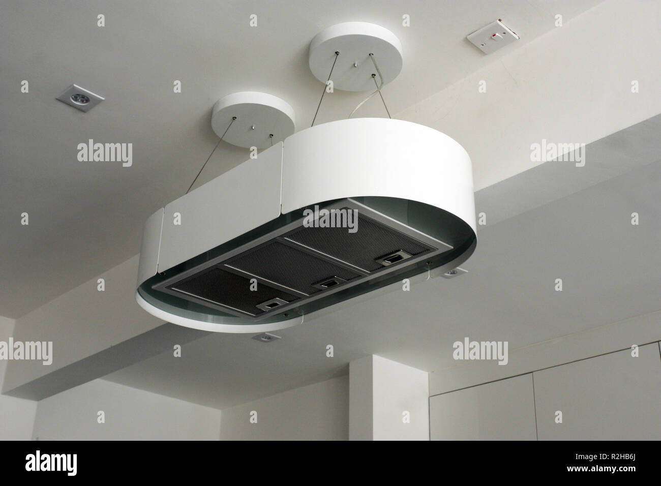An electronic extractor fan chimney for a modern kitchen Stock Photo
