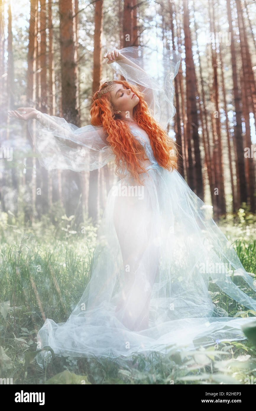 Beautiful Redhead Woman Forest Nymph In A Blue Transparent Light