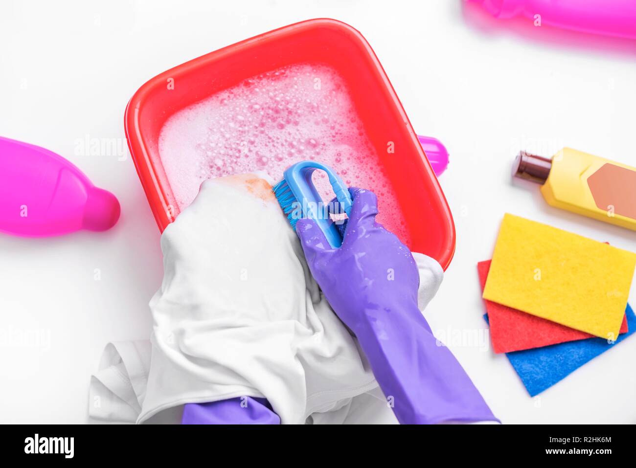 Clean the stain with a brush and detergent. Stock Photo
