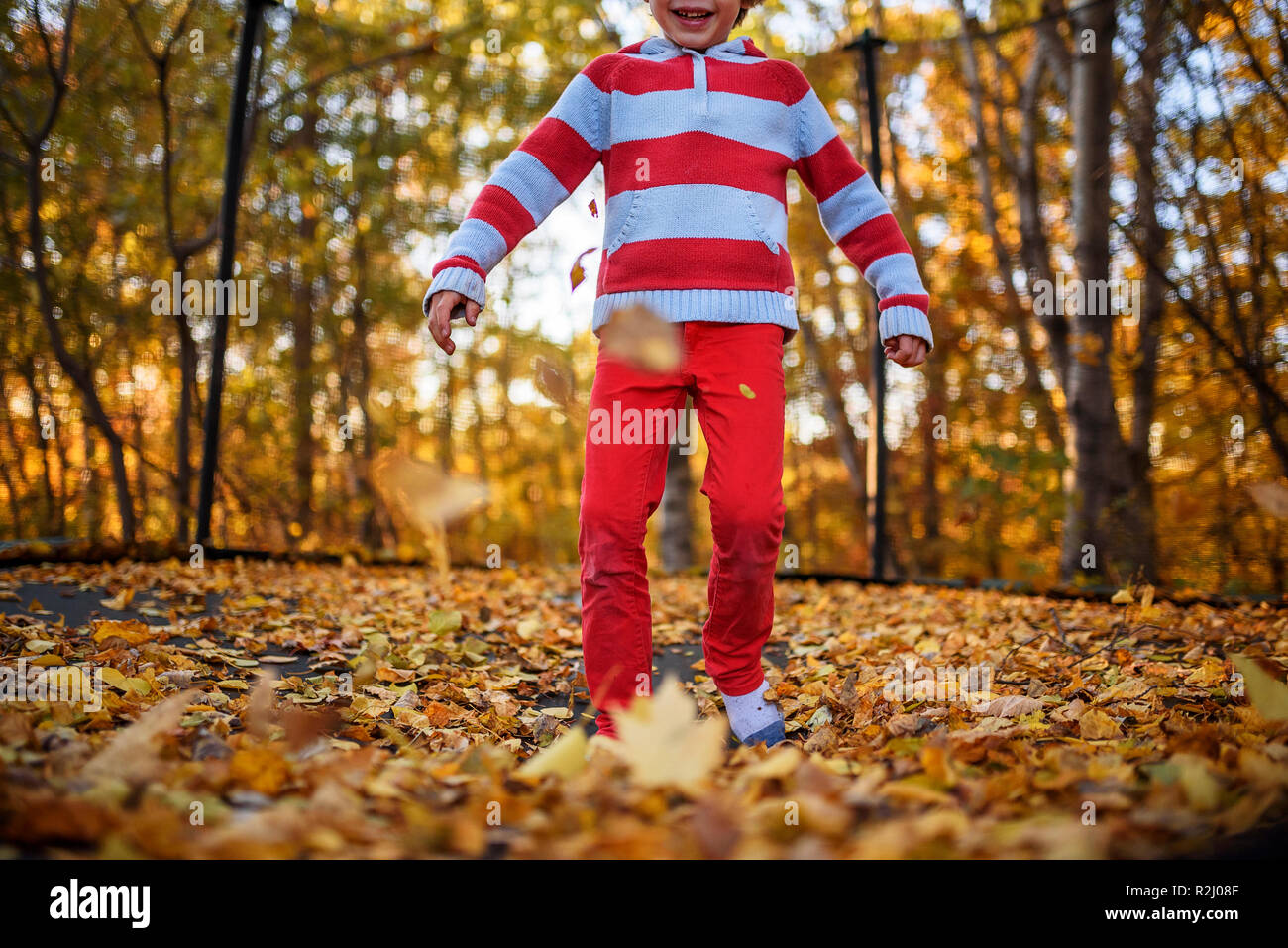 Children jumping on trampoline in hires stock photography and images