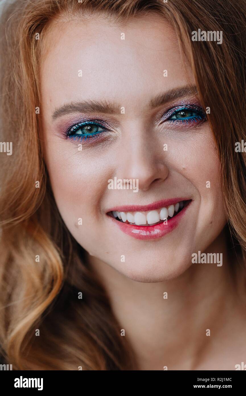Close-up portrait of a redhead woman smiling Stock Photo