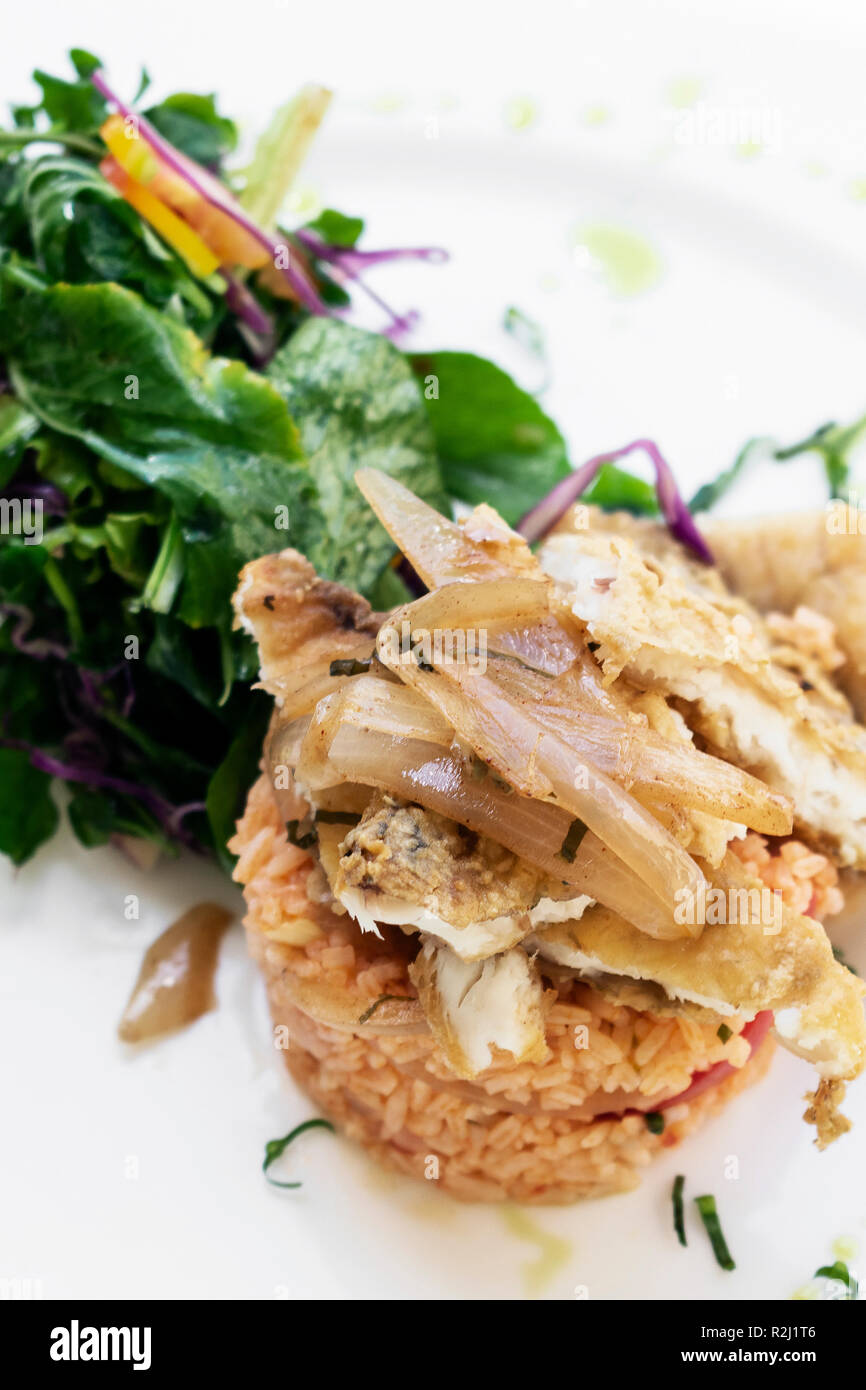 Portuguese fish in Escabeche sauce with tomato rice traditional gourmet