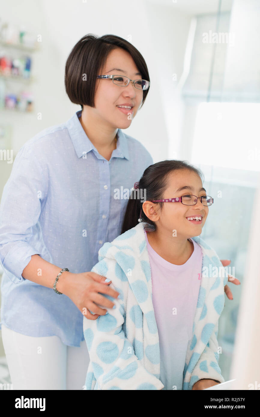Mother and daughter in bathroom Stock Photo