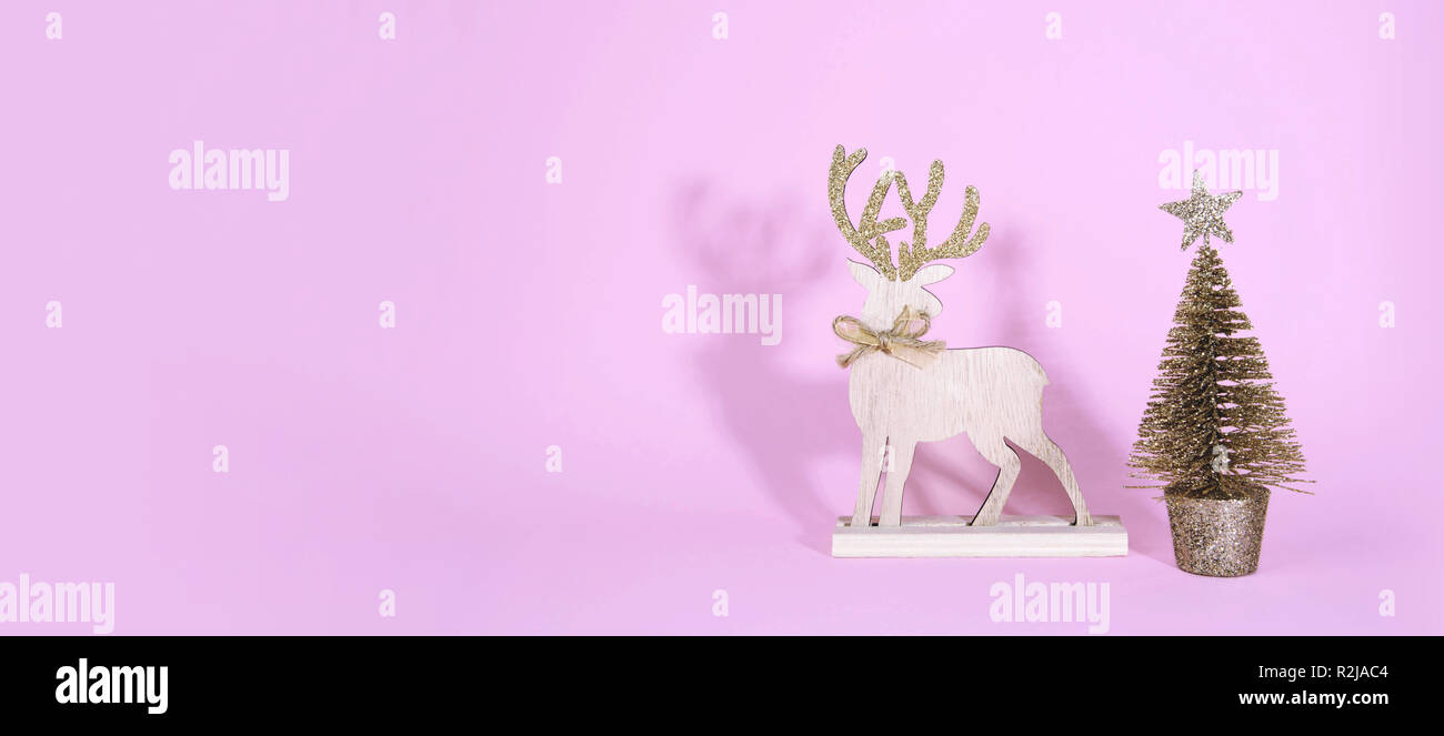 Christmas wooden tree with reindeer over light blue background Stock ...