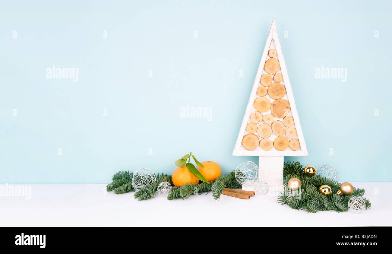 Christmas wooden tree over dark light blue background Stock Photo - Alamy