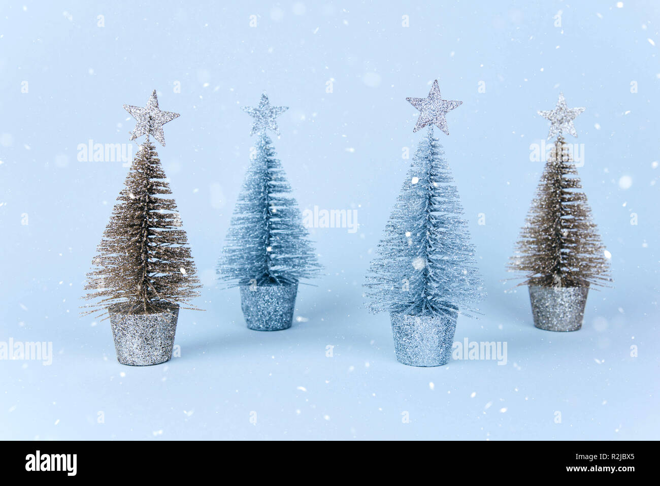 Christmas tree over light blue background Stock Photo - Alamy