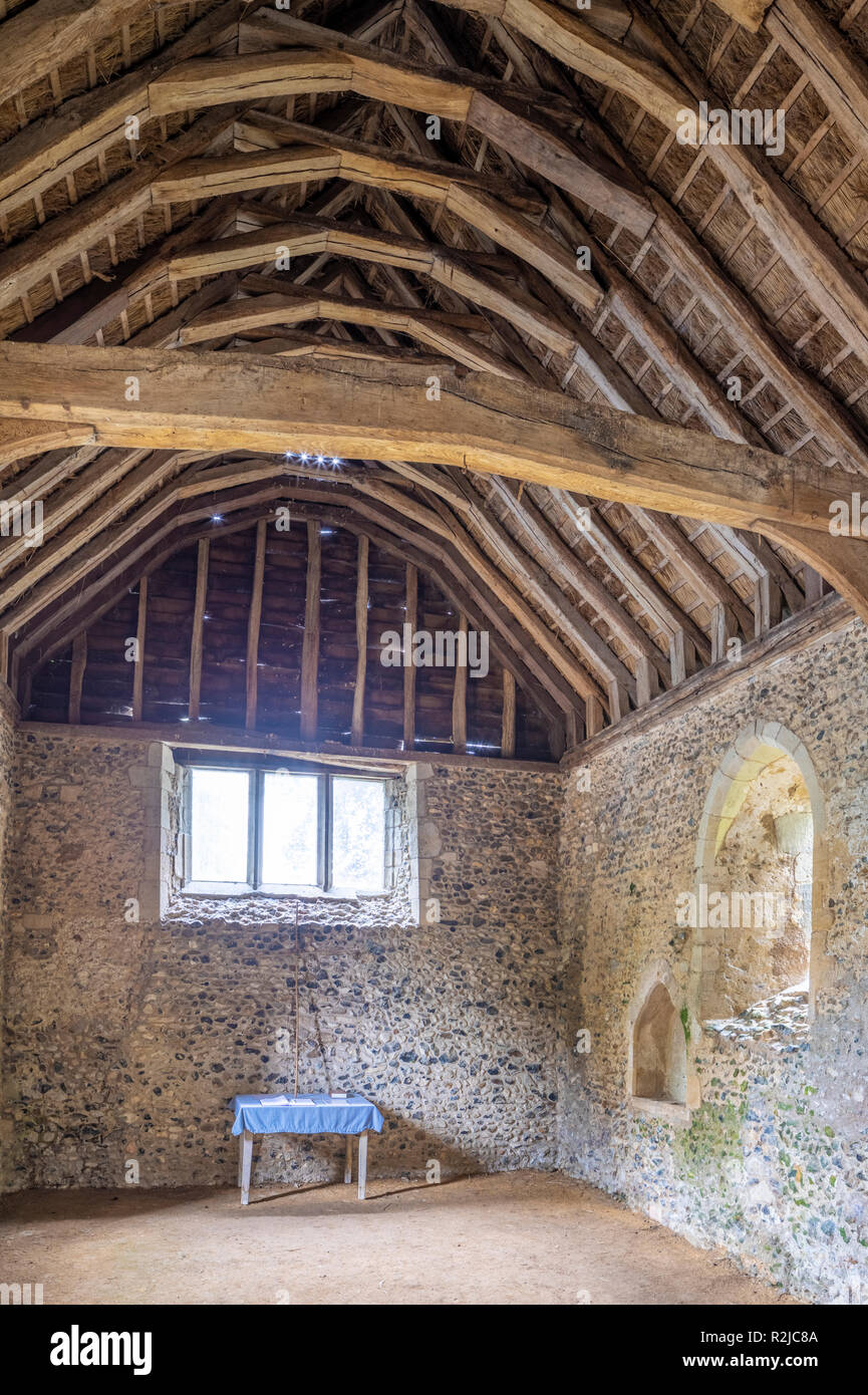 The interior of the 13th century thatched chapel at Lindsey, Suffolk UK Stock Photo