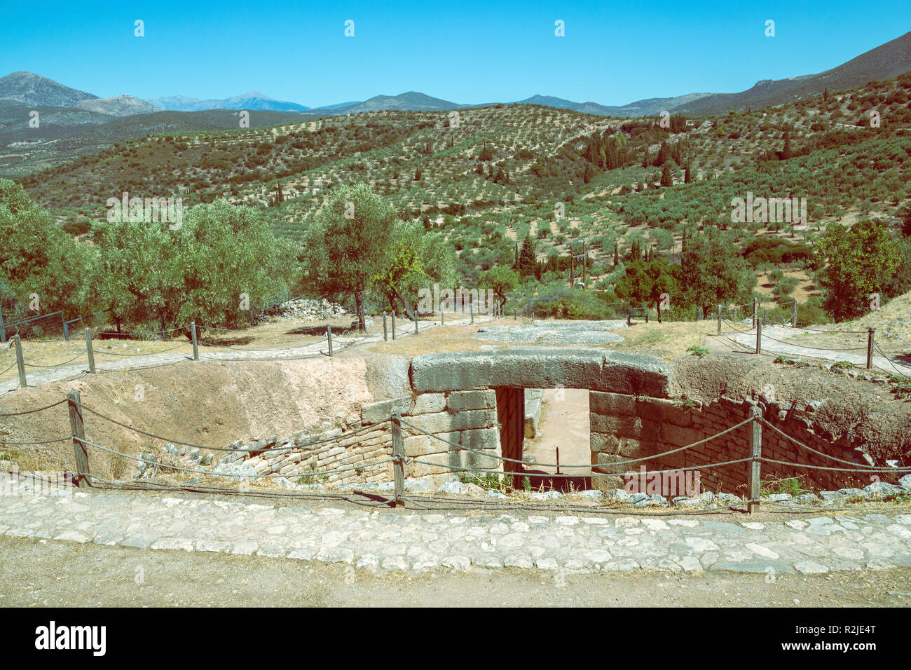 Mycenae tomb, grave circle. Mycenae is an archaeological site in Greece. Vintage style. Stock Photo
