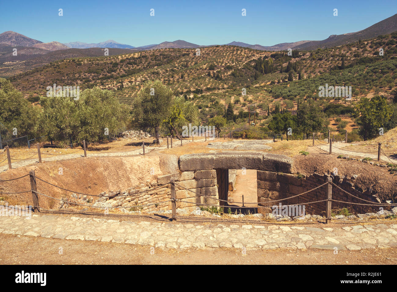Mycenae tomb, grave circle. Mycenae is an archaeological site in Greece. Vintage style. Stock Photo