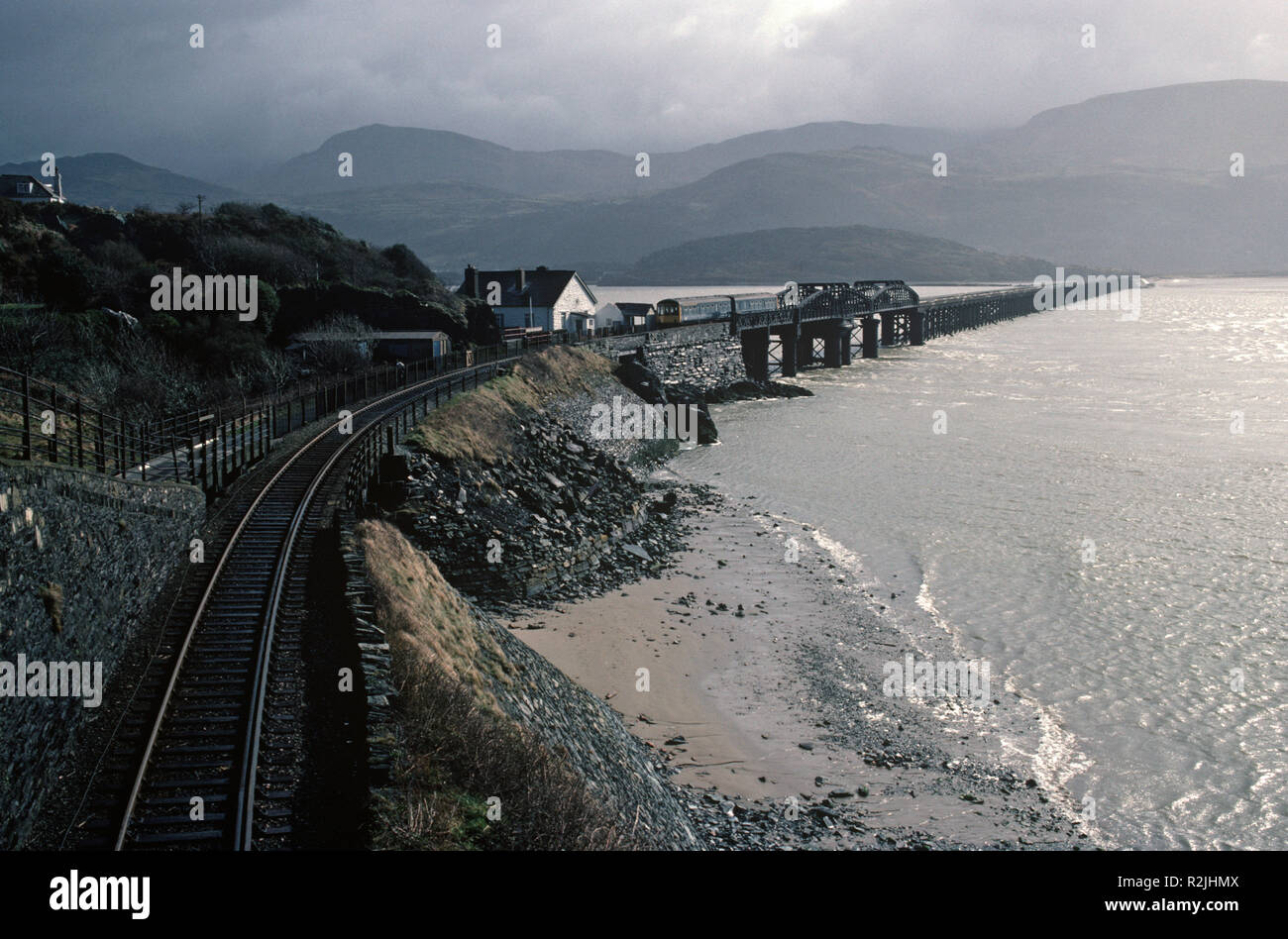 British Rail Diesel Multiple Unit, DMU, train on the Dovey Junction to Pwllheli Cambrian Coast railway line, Barmouth Bridge over River Mawddach, Mid Wales, Great Britain Stock Photo