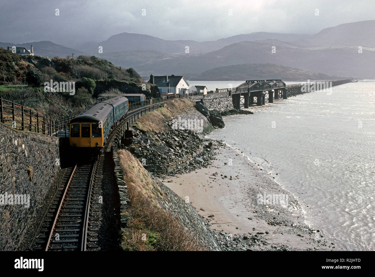 British Rail Diesel Multiple Unit, DMU, train on the Dovey Junction to Pwllheli Cambrian Coast railway line, Barmouth Bridge over River Mawddach, Mid Wales, Great Britain Stock Photo