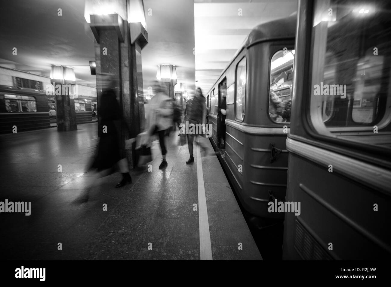 Blurry people upcomig to the Heroiv Dnipra station platform. Underground Metropolitan, Kyiv, Ukraine Stock Photo