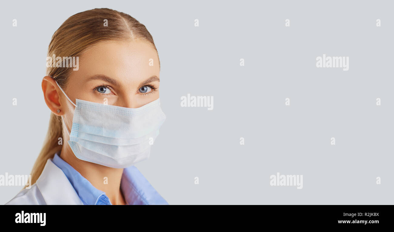 Woman doctor wearing a mask . Stock Photo