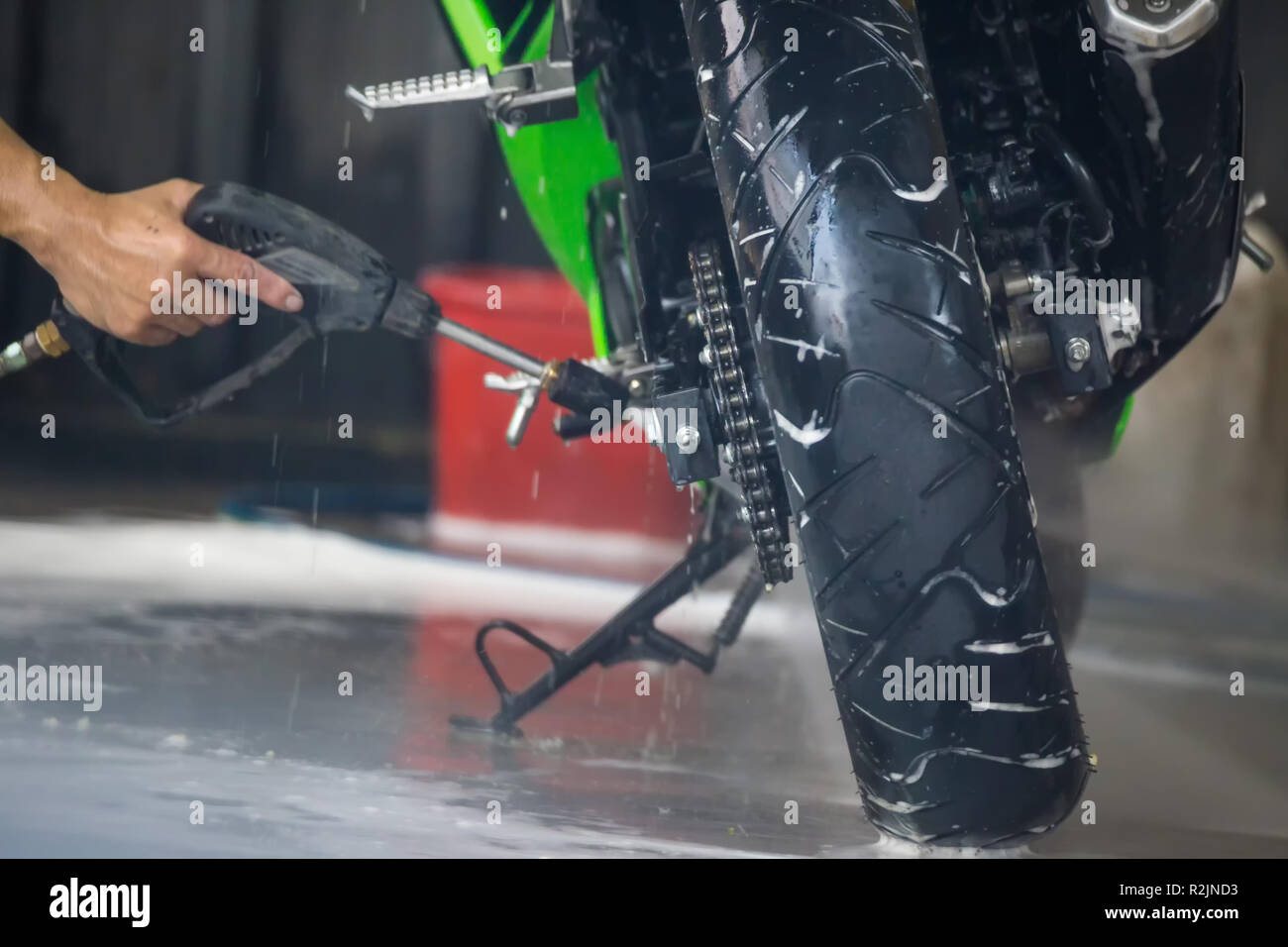 Motorcycle clean service. Employees are washing motorbikes Stock Photo