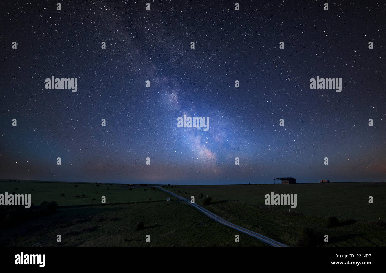 Stunning vibrant Milky Way composite image over landscape of English ...