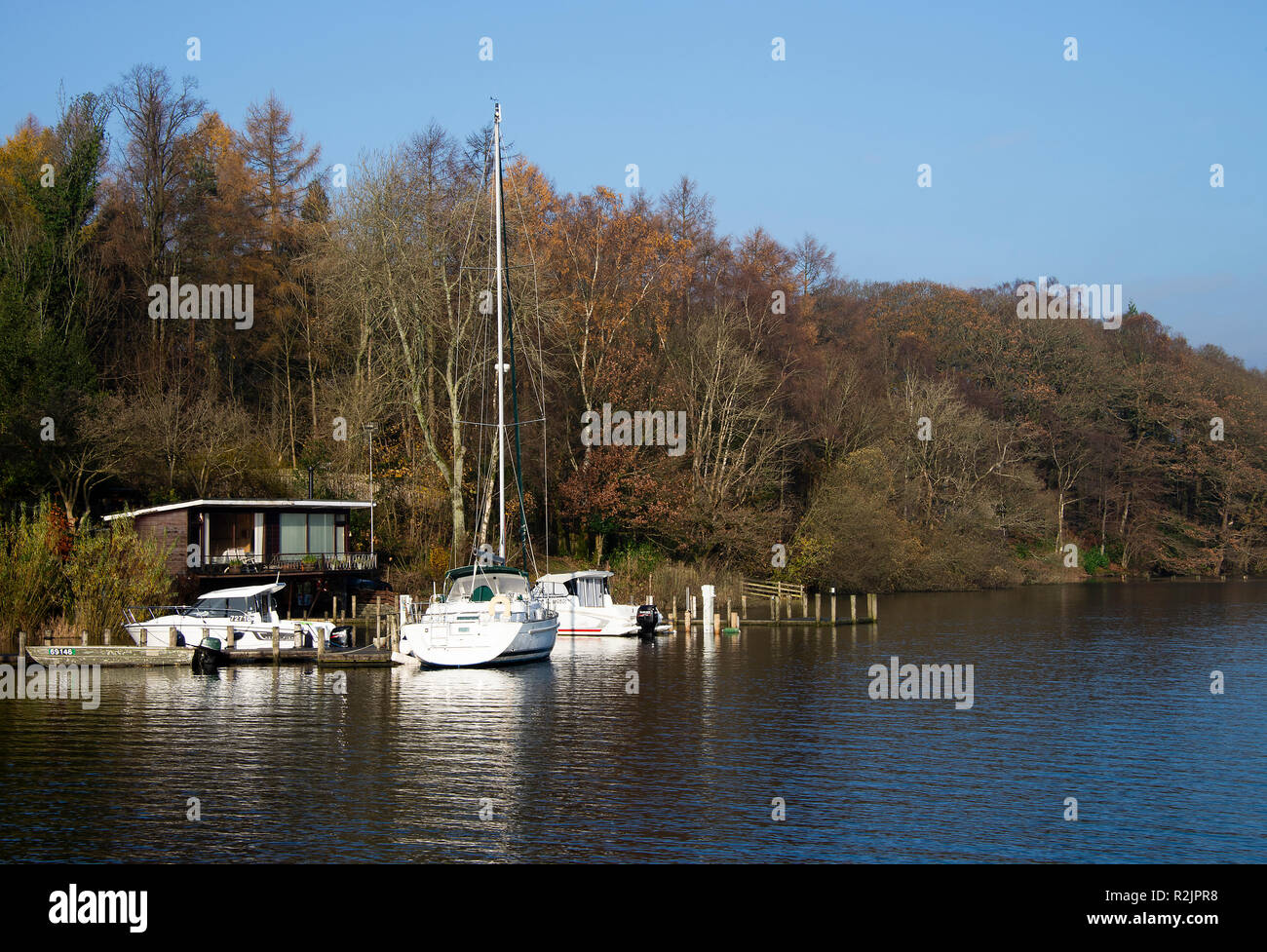 A Yacht Moored near Lakeside on Lake Windermere in the Lake District National Park on a Lovely Autumn Day Cumbria England United Kingdom UK Stock Photo