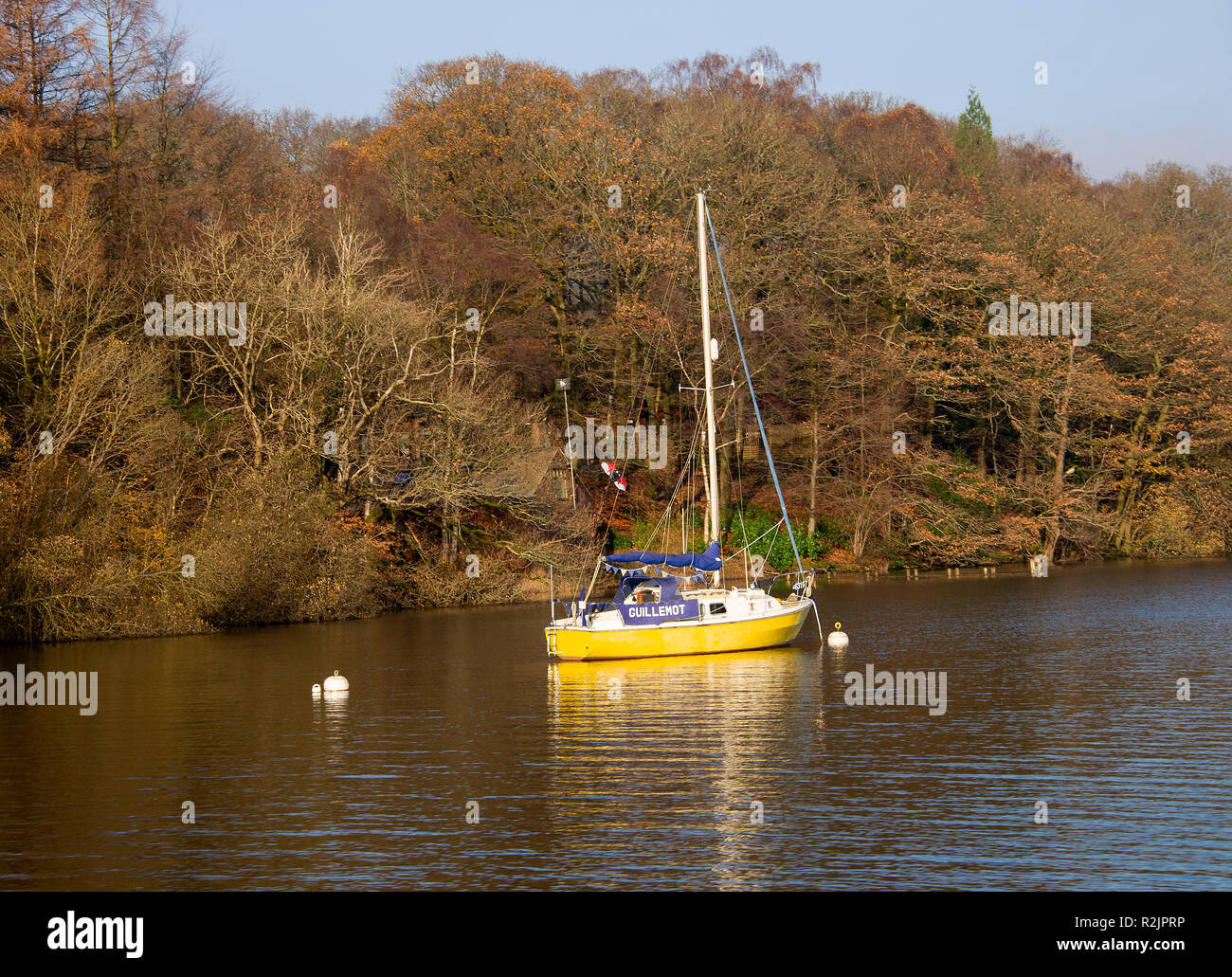 A Yacht Moored near Lakeside on Lake Windermere in the Lake District National Park on a Lovely Autumn Day Cumbria England United Kingdom UK Stock Photo