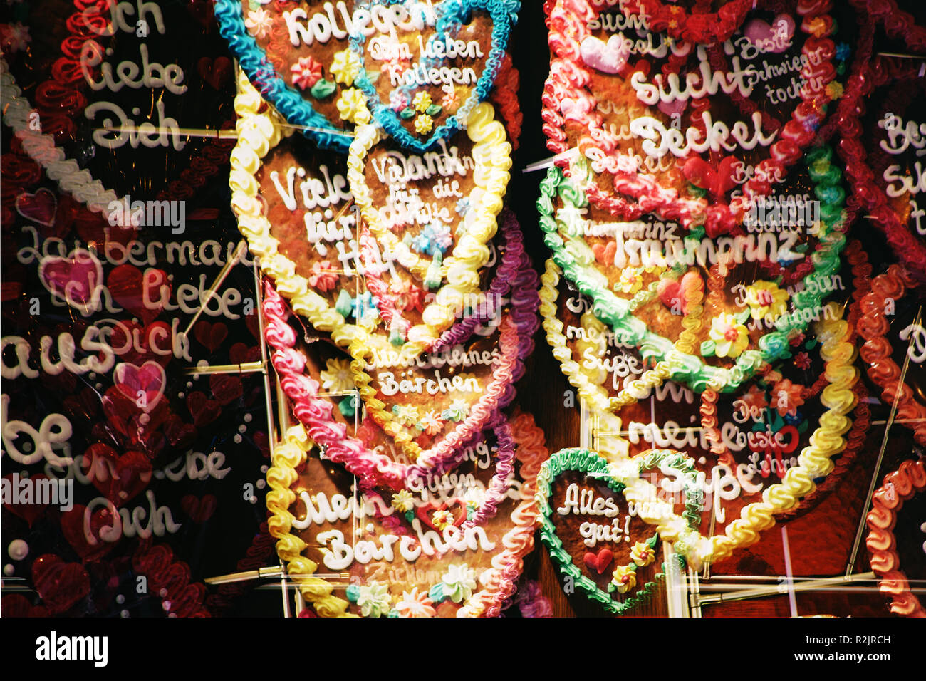 Gingerbread hearts lettered with love spells on a ticket booth at the fair Stock Photo