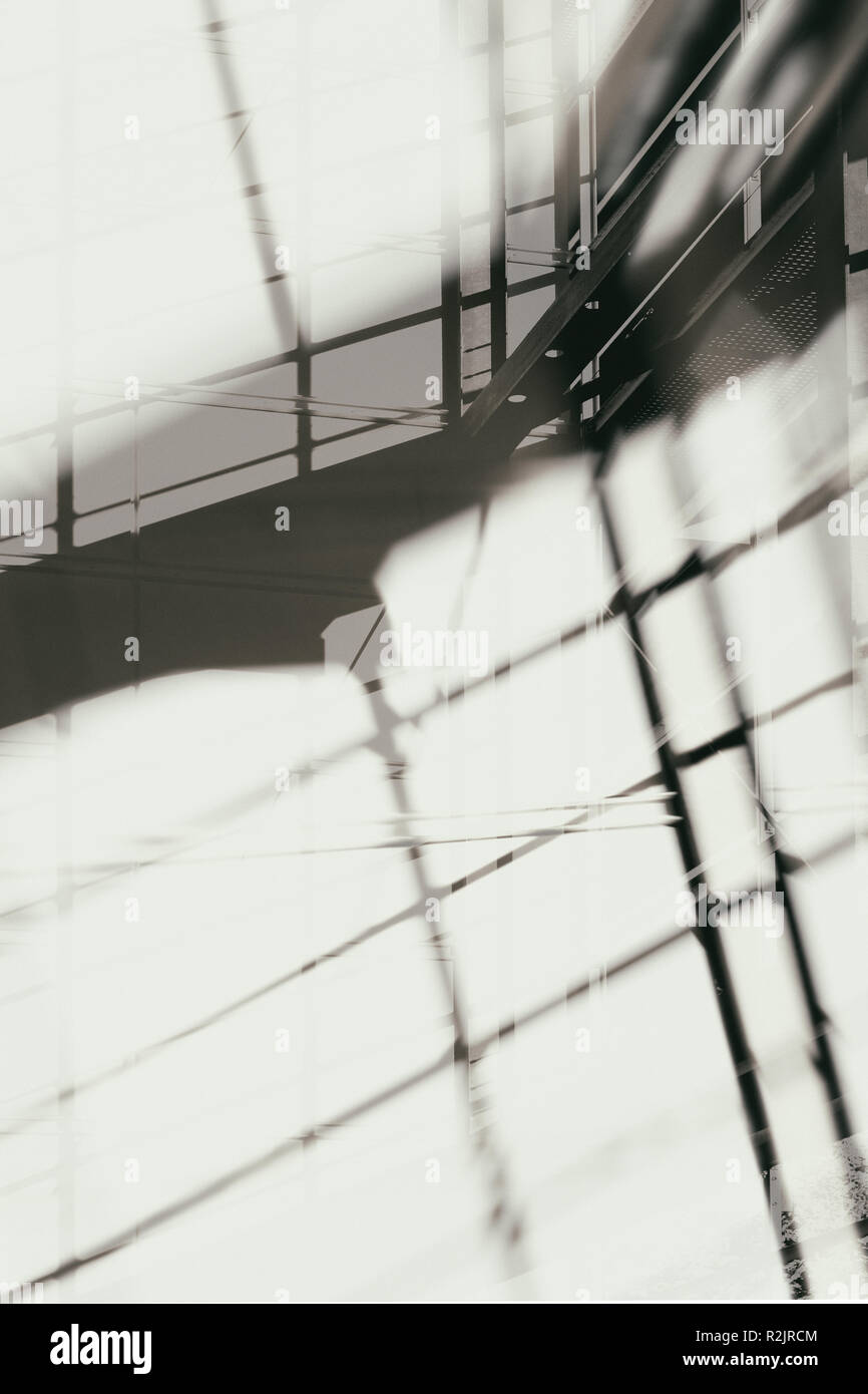 Abstract double exposure of the outer frame of a modern facade with shadows Stock Photo