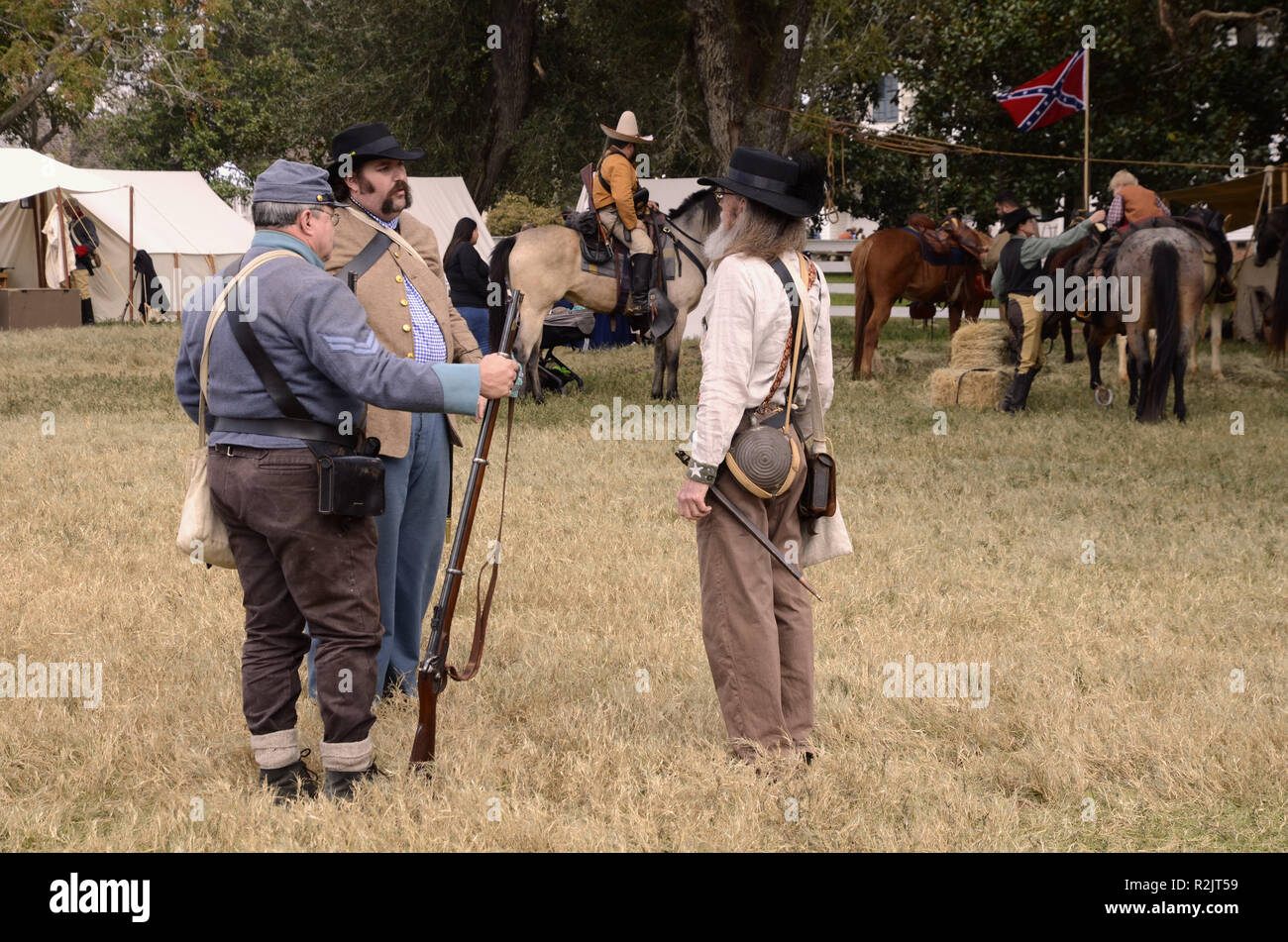 American Civil War reenactment; men at Confederate camp discuss strategy; Liendo Plantation, Texas, USA. Stock Photo