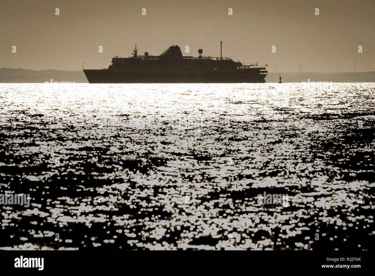 Cruise ship at sunset Stock Photo - Alamy