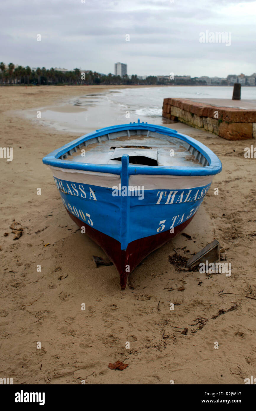 The beach of Salou (Costa Daurada) with old fishing boats in winter. Stock Photo
