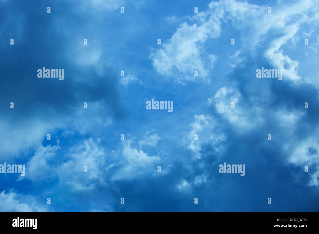 blue sky with clouds closing the sun Stock Photo Alamy