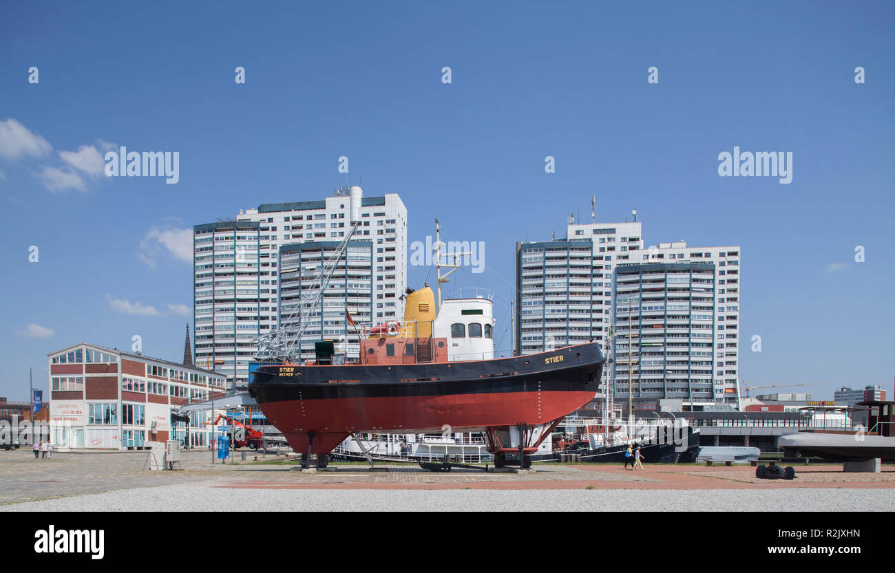 Museum ship oceangoing tug with Columbuscenter, at the museum harbor, Havenwelten, Bremerhaven, Bremen, Germany, Europe Stock Photo