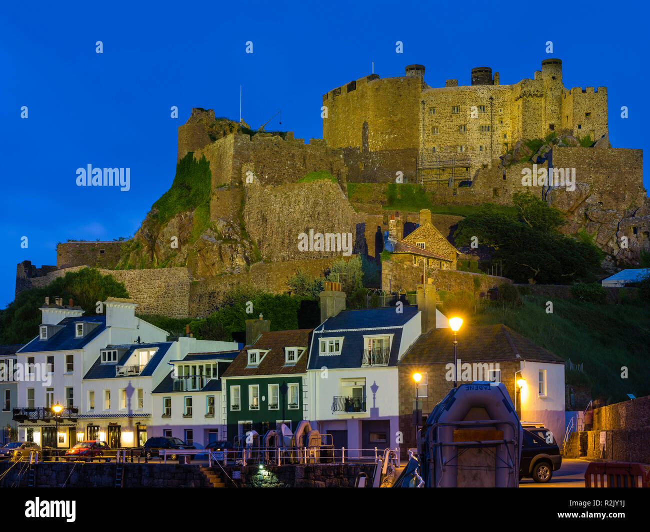 Gorey castle on jersey at the blue hour hires stock photography and