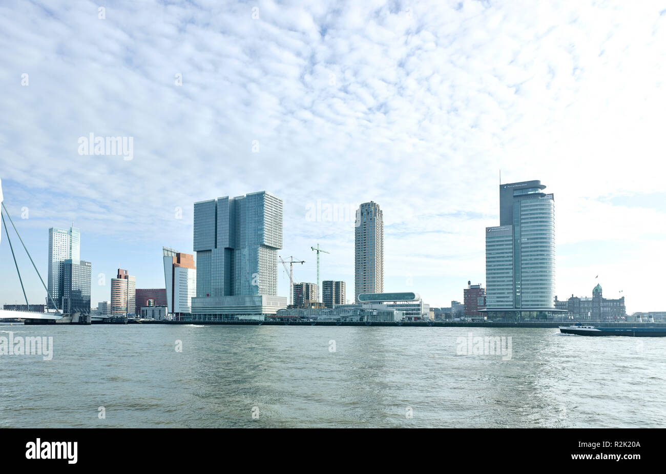 Rotterdam, district 'Head of South', seen from the Veerhaven, with the Erasmus Bridge (Ben van Berkel 1992-1997), and the Rotterdam (OMA, 2002-2014), the largest building of Netherlands, to the right the tower New Orleans (Alvaro Siza , 2008-2013), highest residential tower of Netherlands and double tower World Port Center (Norman Foster, 1997-2003) Stock Photo