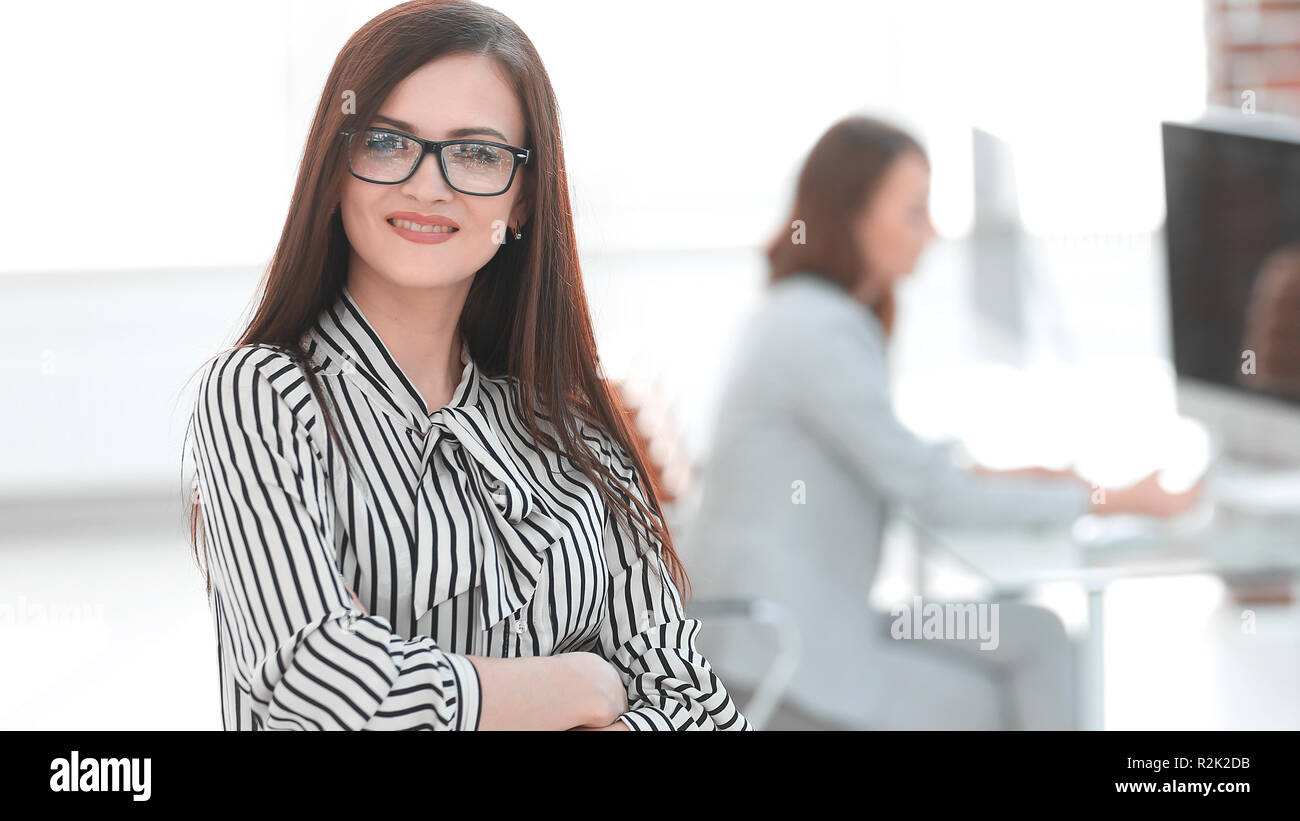 successful business woman on the background of her office Stock Photo ...