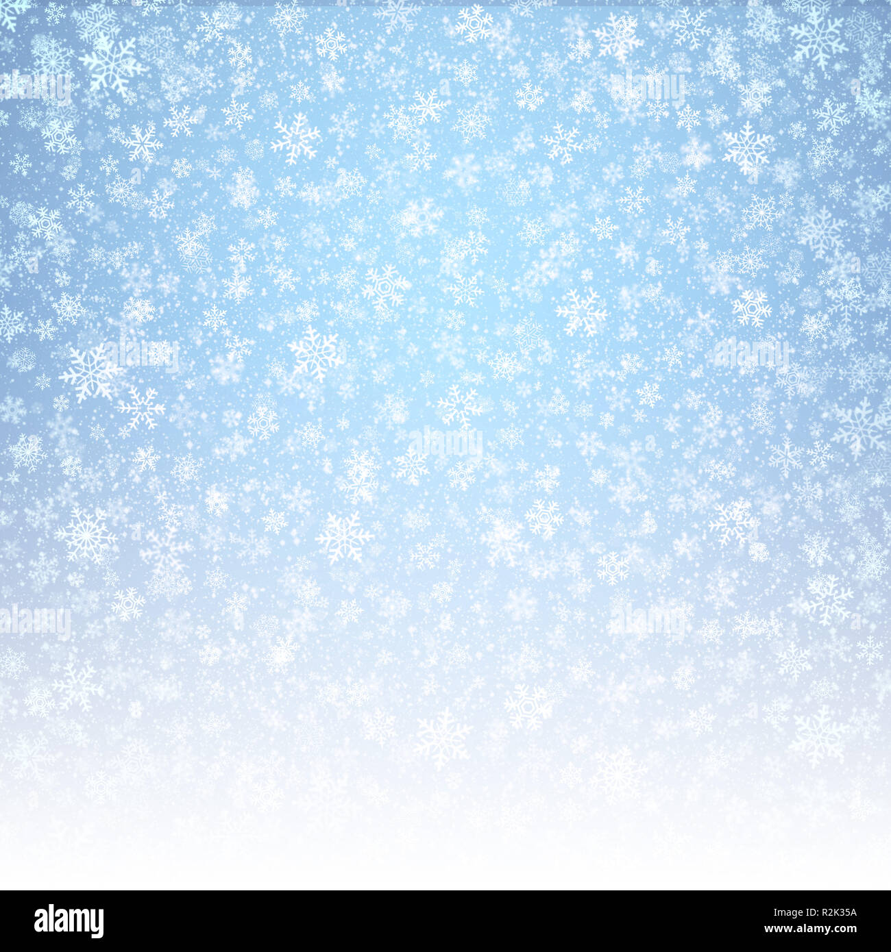 White snowflakes shapes and falling snow on an icy blue background. Winter seasonal material. Stock Photo