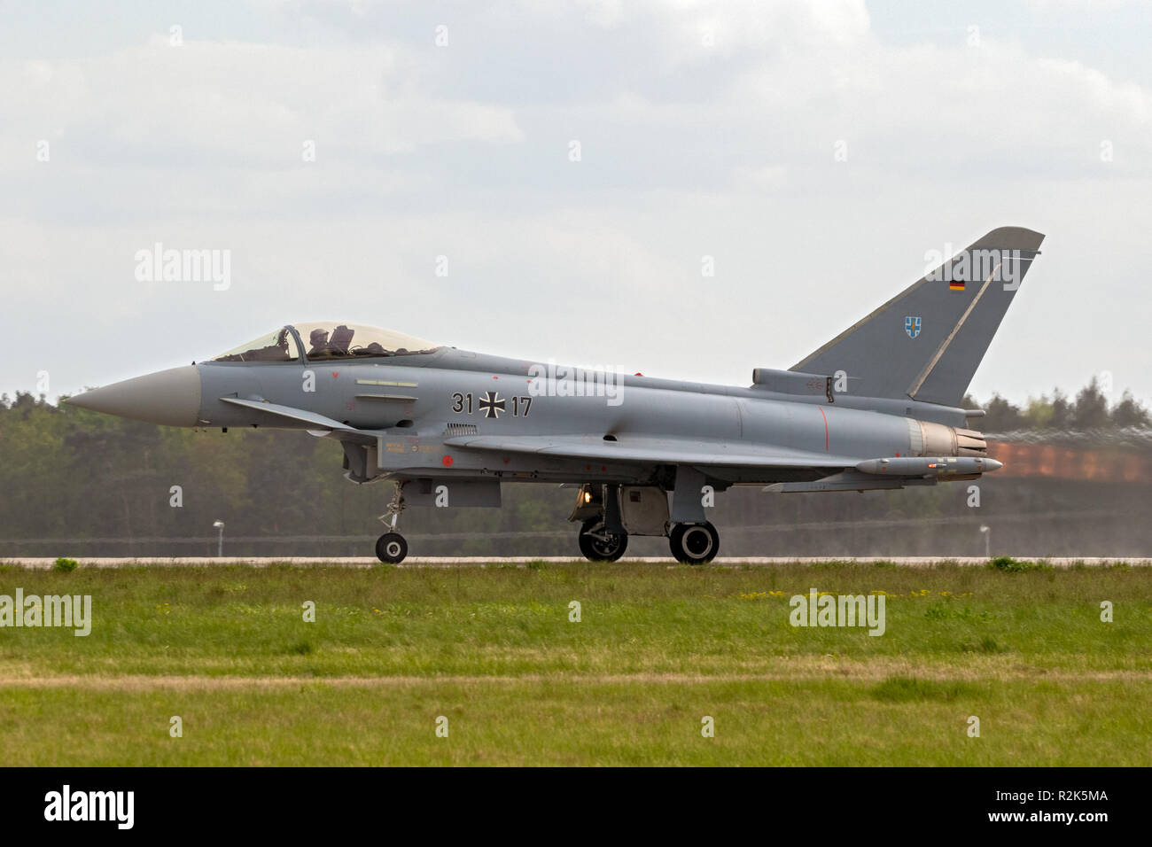 BERLIN - APR 27, 2018: German air force Eurofighter EF-2000 Typhoon fighter jet plane taking off during the Berlin ILA Air Show. Stock Photo