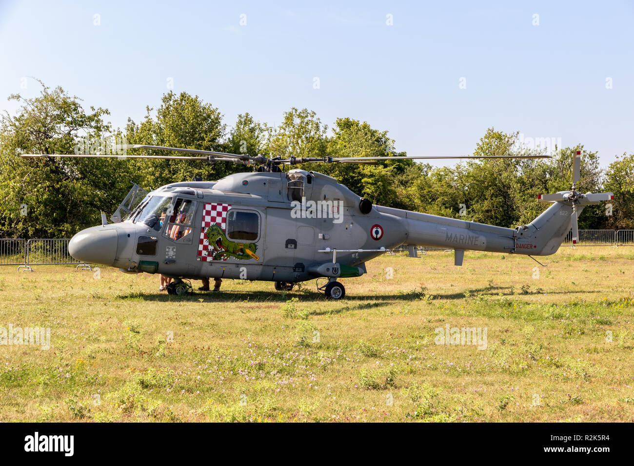 NANCY, FRANCE - JUL 1, 2018: French Navy Westland Lynx helicopter in a grass field at Nancy Airbase. Stock Photo