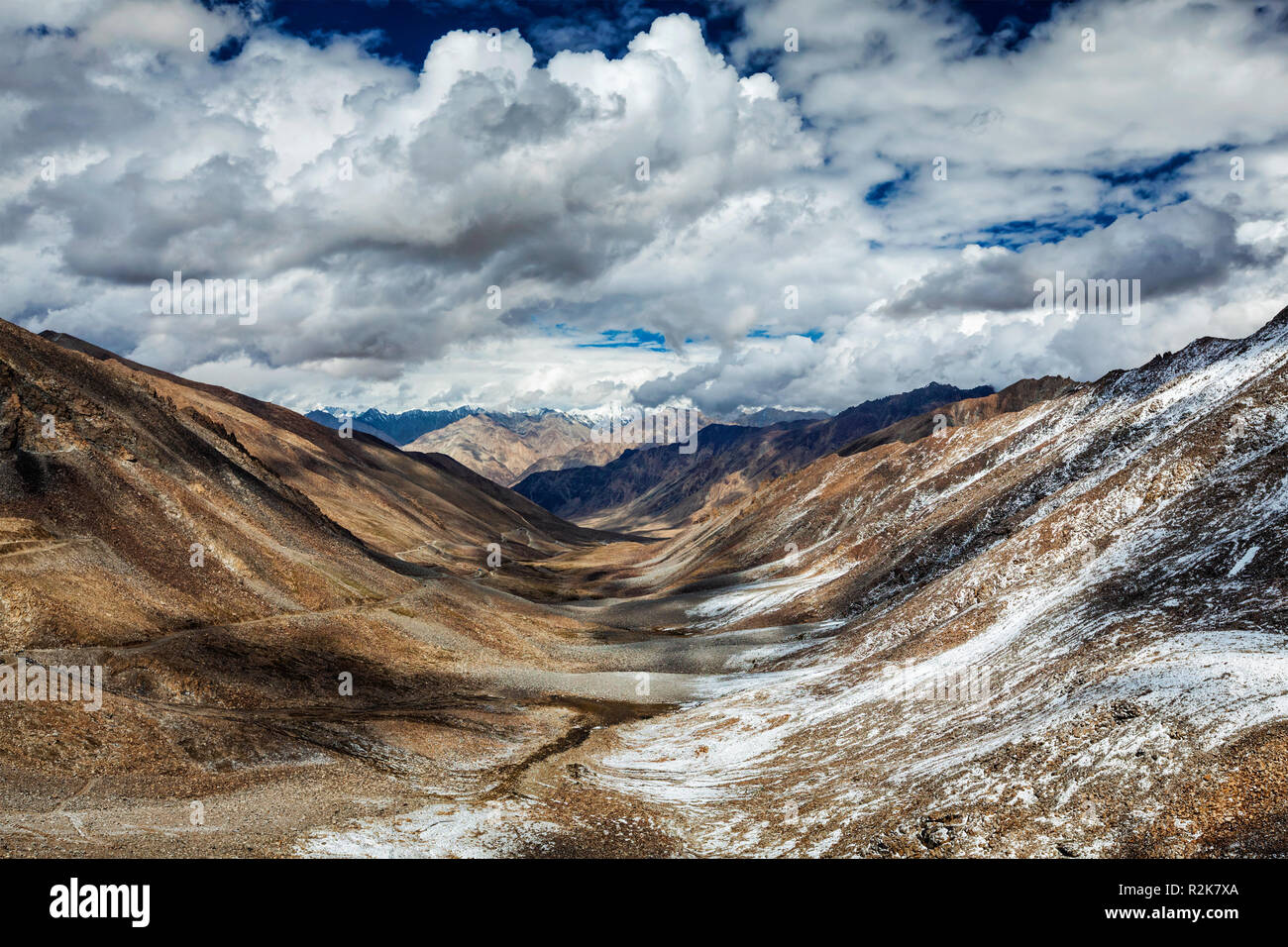 View over valley and Karakorum range from Khardung La pass, Ladak Stock Photo