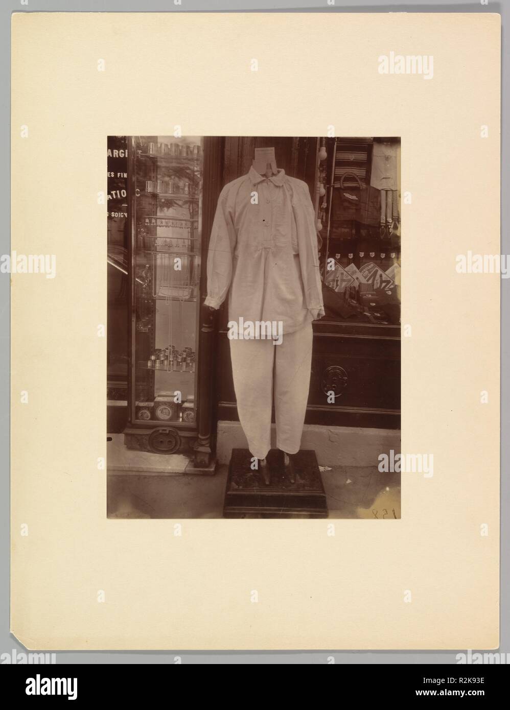 Avenue des Gobelins. Artist: Eugène Atget (French, Libourne 1857-1927 Paris). Dimensions: 36.8 x 28.6 cm (14 1/2 x 11 1/4 in.). Date: 1927.  In this headless mannequin, clothed in a simple white uniform, Atget recognized a modern version of the commedia dell'arte clown Gilles, depicted by the eighteenth-century painter Jean Antoine Watteau, for example.  It was for the type of transforming vision seen in this picture, which is among the very last in Atget's lifelong exploration of Paris, that the artist's work was so enthusiastically embraced by the Surrealists. Museum: Metropolitan Museum of  Stock Photo