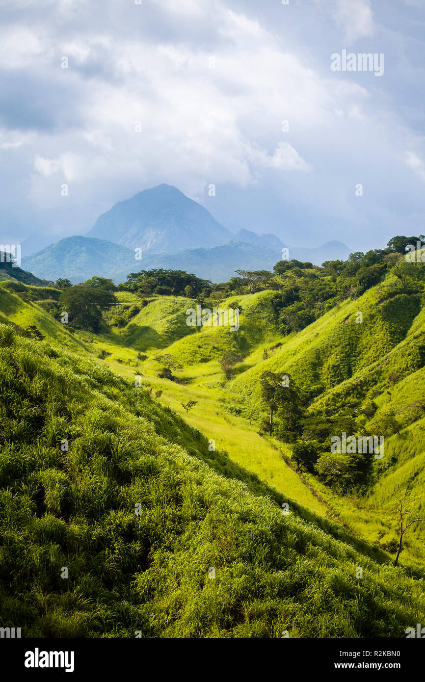 Verdant green hills and distant peak in Chiapas, Mexico. Stock Photo