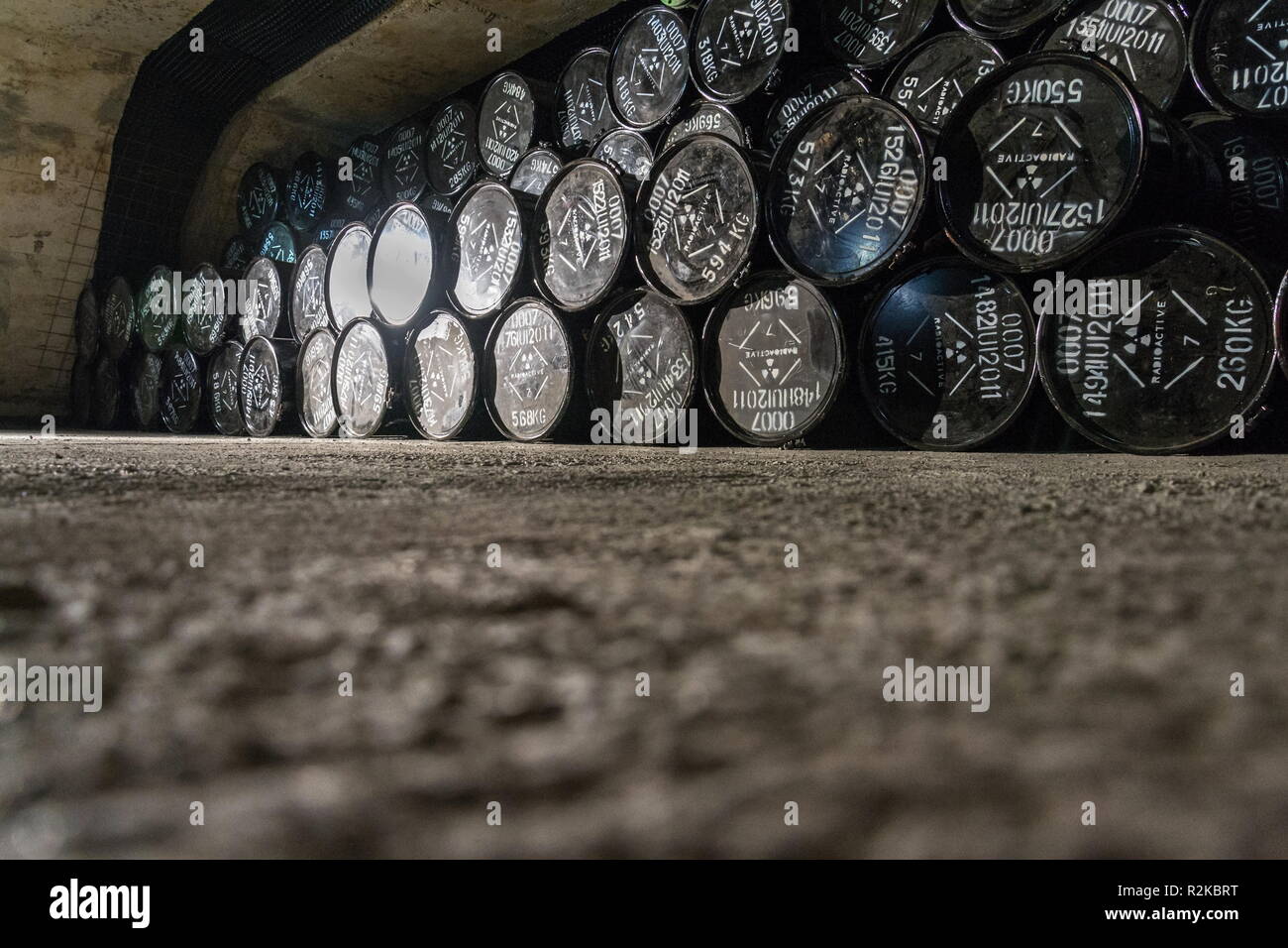 Radioactive waste package barrels in underground repository, terrorism pollution apocalypse concept Stock Photo