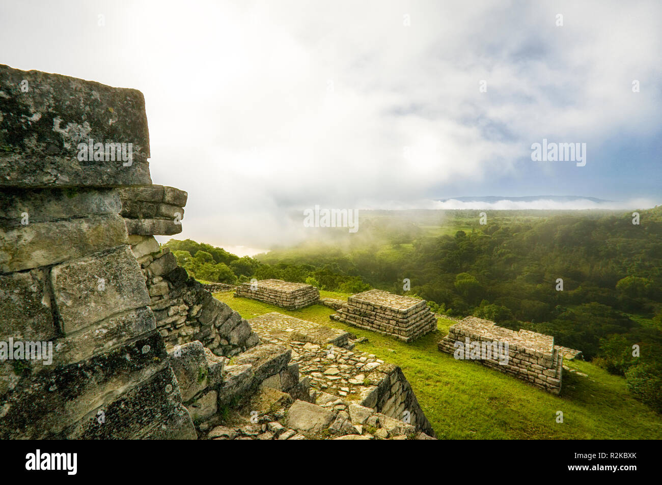 Fog moves in near the main pyramid at the Mayan ruins of Chinkultic, Chiapas, Mexico. Stock Photo