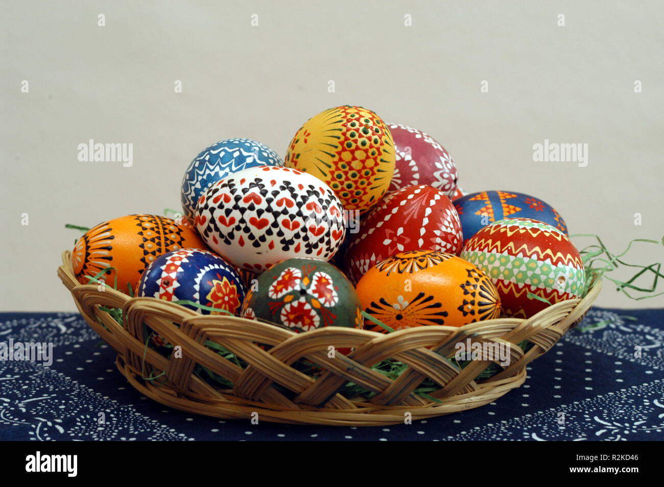 painted easter eggs in a basket Stock Photo - Alamy