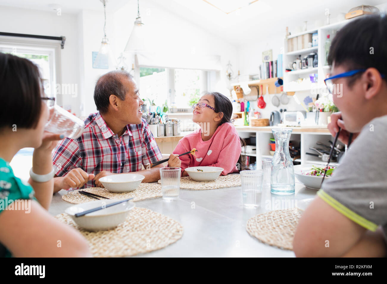 Asian family eating dinner table hi-res stock photography and images ...