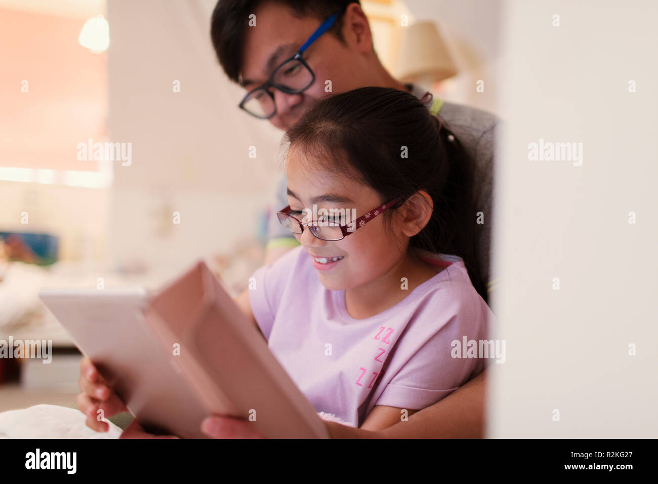 Father and daughter using digital tablet Stock Photo