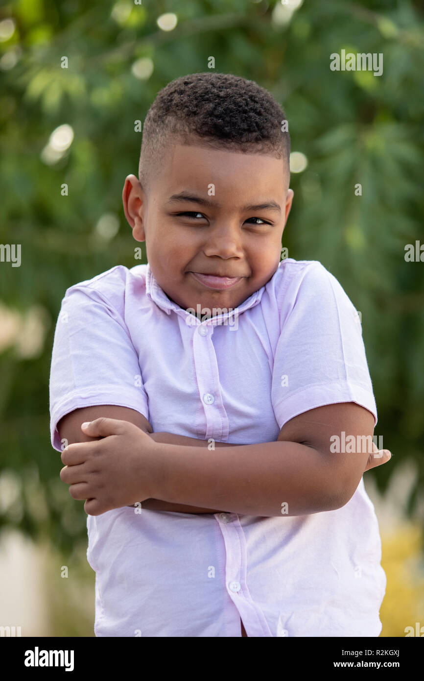 Angry latin child in a day in the park Stock Photo