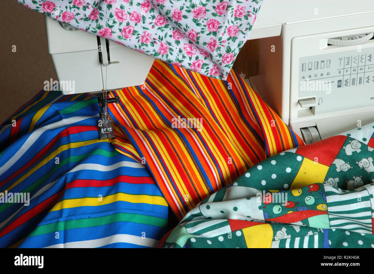 sewing machine with various fabrics Stock Photo Alamy