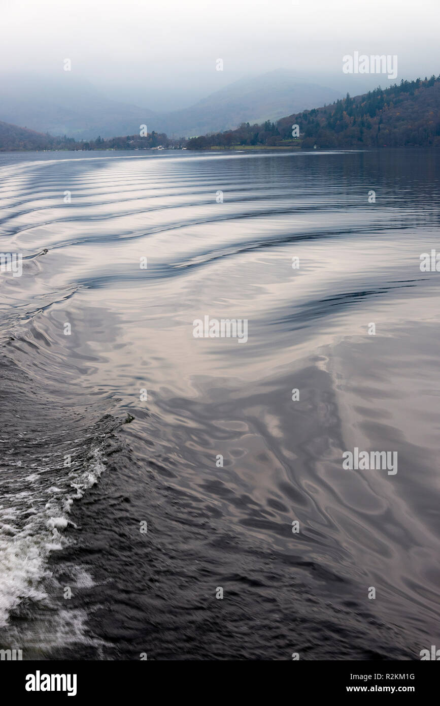 Small Waves and Ripples Caused by Boat Wake with Reflections on Lake Windermere Lake District National Park Cumbria England United Kingdom UK Stock Photo