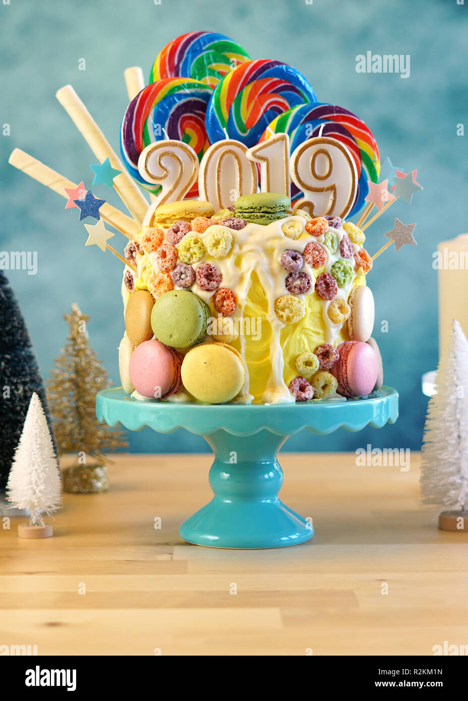 Happy New Year's candy land lollipop drip cake with 2019 candles ...