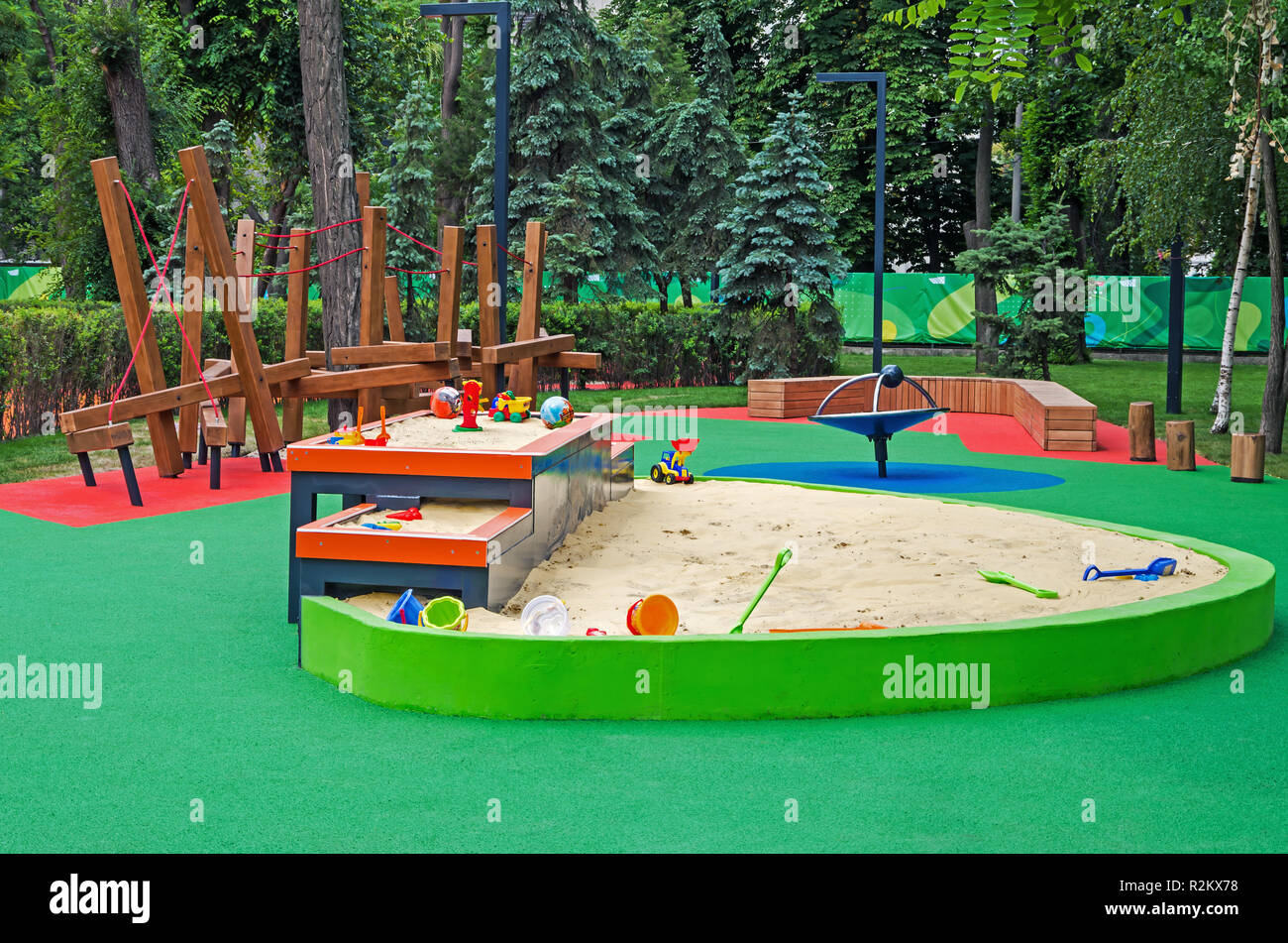 Multi-level sandbox in a children's inclusive gaming park on a summer sunny day Stock Photo