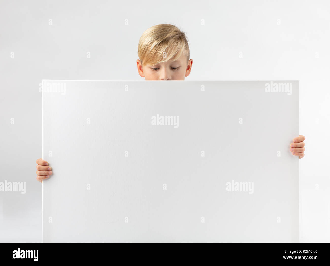 Boy Holding Blank Sign High Resolution Stock Photography and Images - Alamy